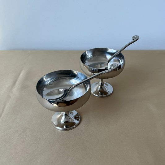 Side profile of an Italian mid-century stainless steel dessert cups or silver metal ice cream bowls, highlighting its polished footed design.