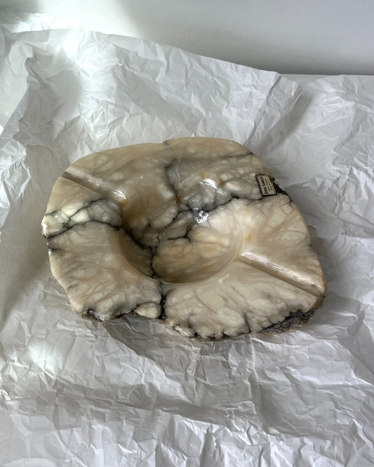 Close-up of the natural beige to deep grey veining in the hand-carved alabaster, highlighting the unique texture of the brutalist ashtray.