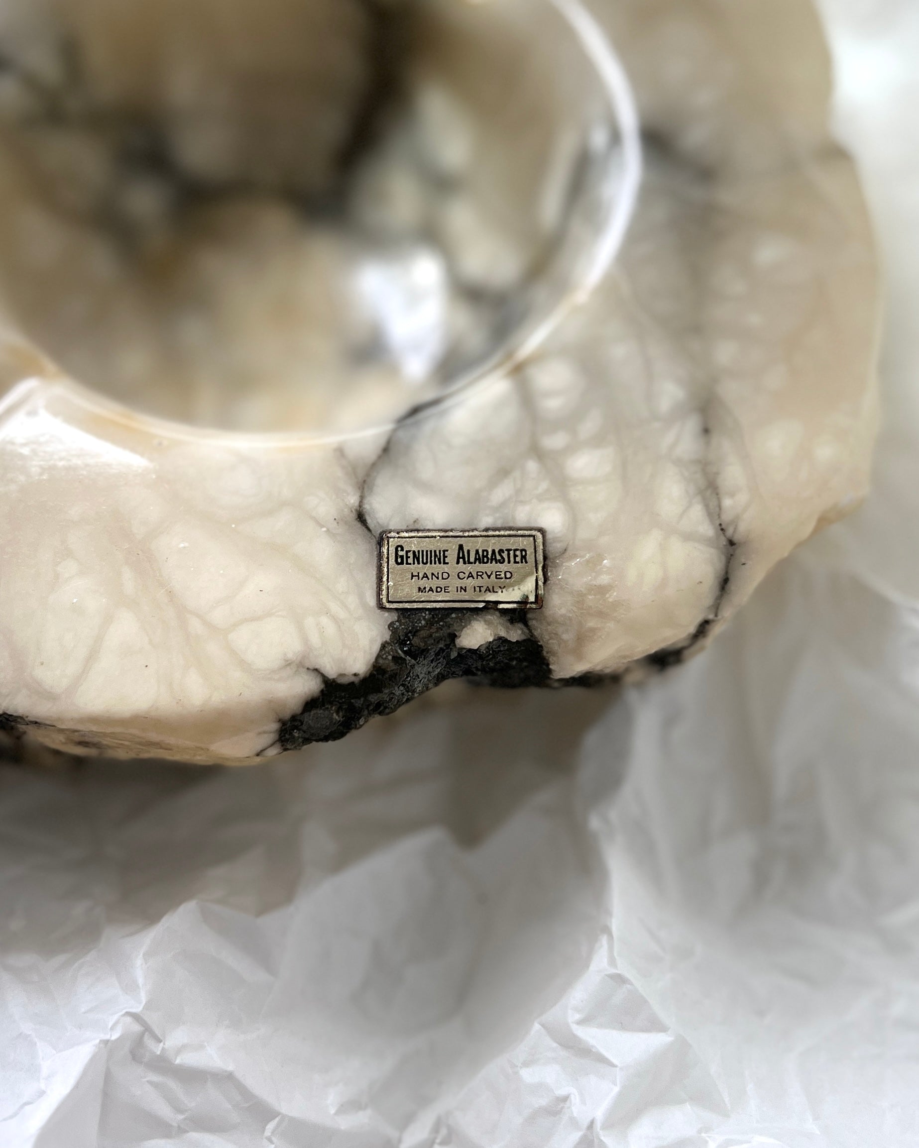 Side view of the 1960s Italian alabaster ashtray, showcasing its distinct brutalist design with bold sculptural lines.