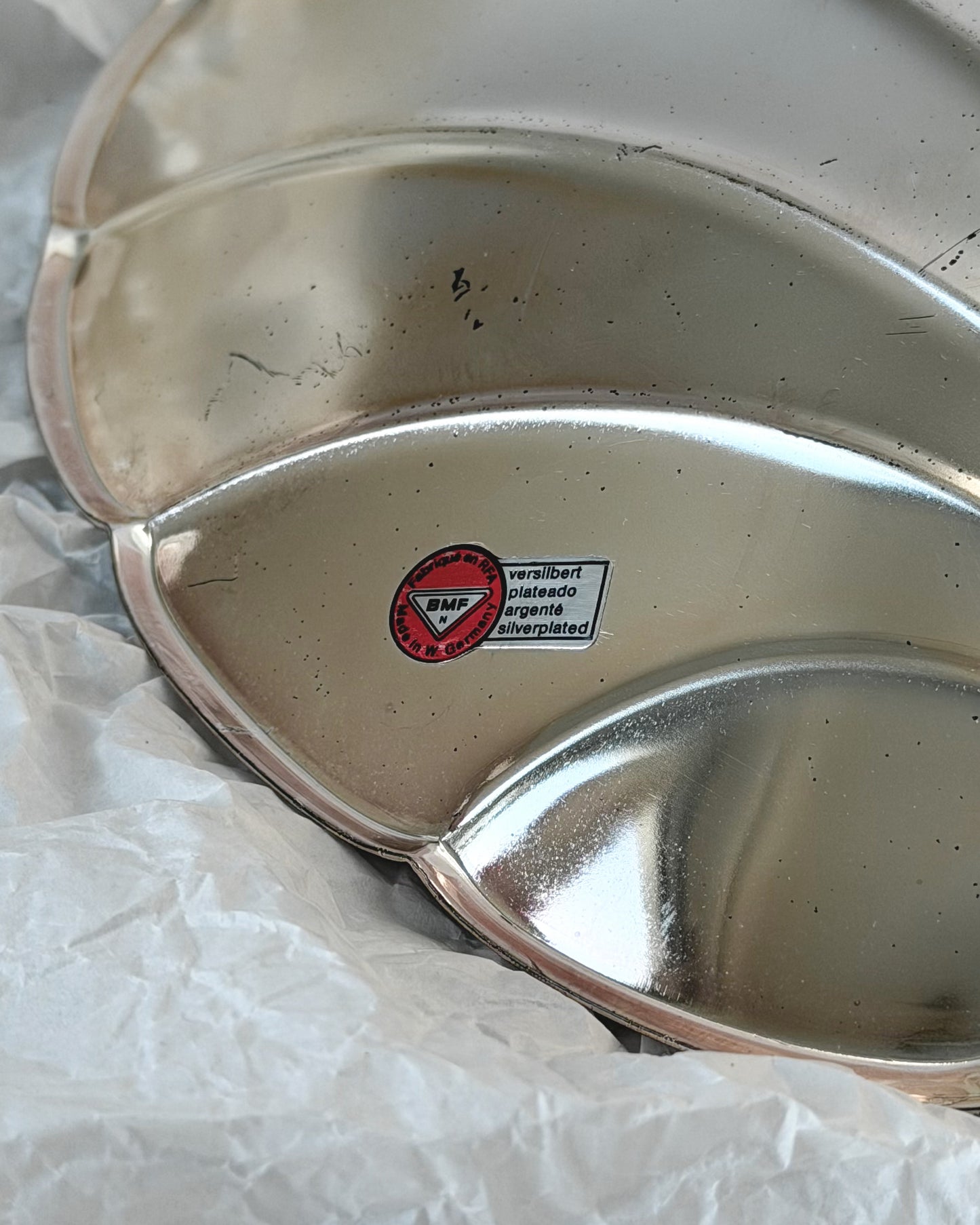 A close-up shot of the original BMF N sticker, confirming this silver-plated ikora shell was made in West Germany by Bayerische Metallwarenfabrik.