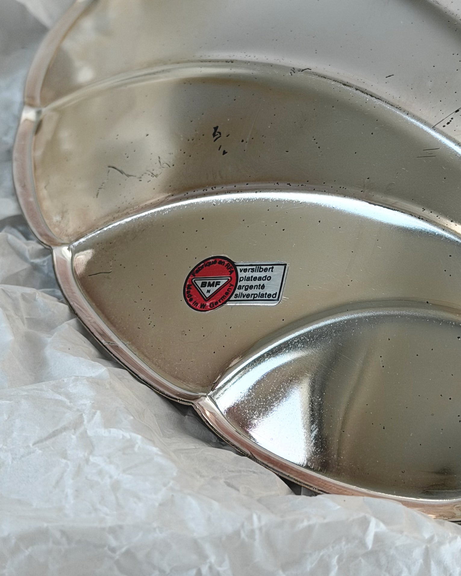 A close-up shot of the original BMF N sticker, confirming this silver-plated ikora shell was made in West Germany by Bayerische Metallwarenfabrik.