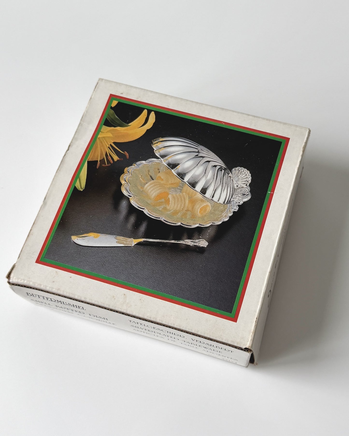A deadstock vintage shell dish presented in its original 1970s packaging, showcasing its pristine condition as a rare collector's find.