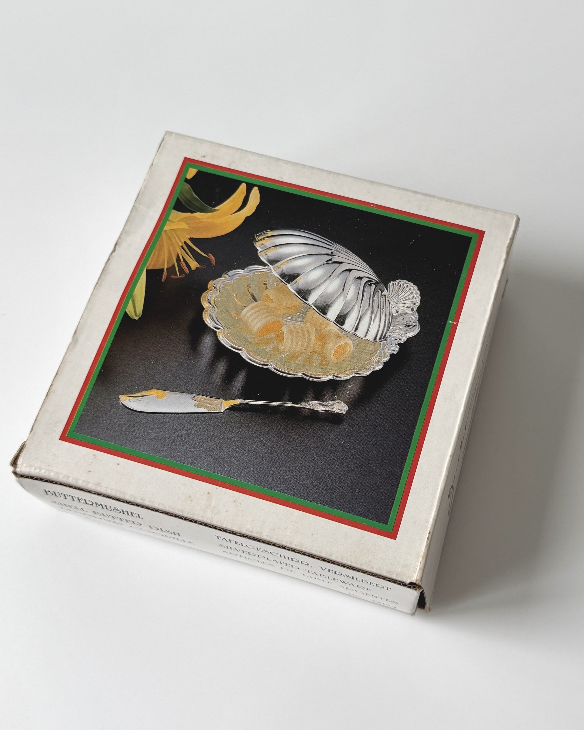 A deadstock vintage shell dish presented in its original 1970s packaging, showcasing its pristine condition as a rare collector's find.
