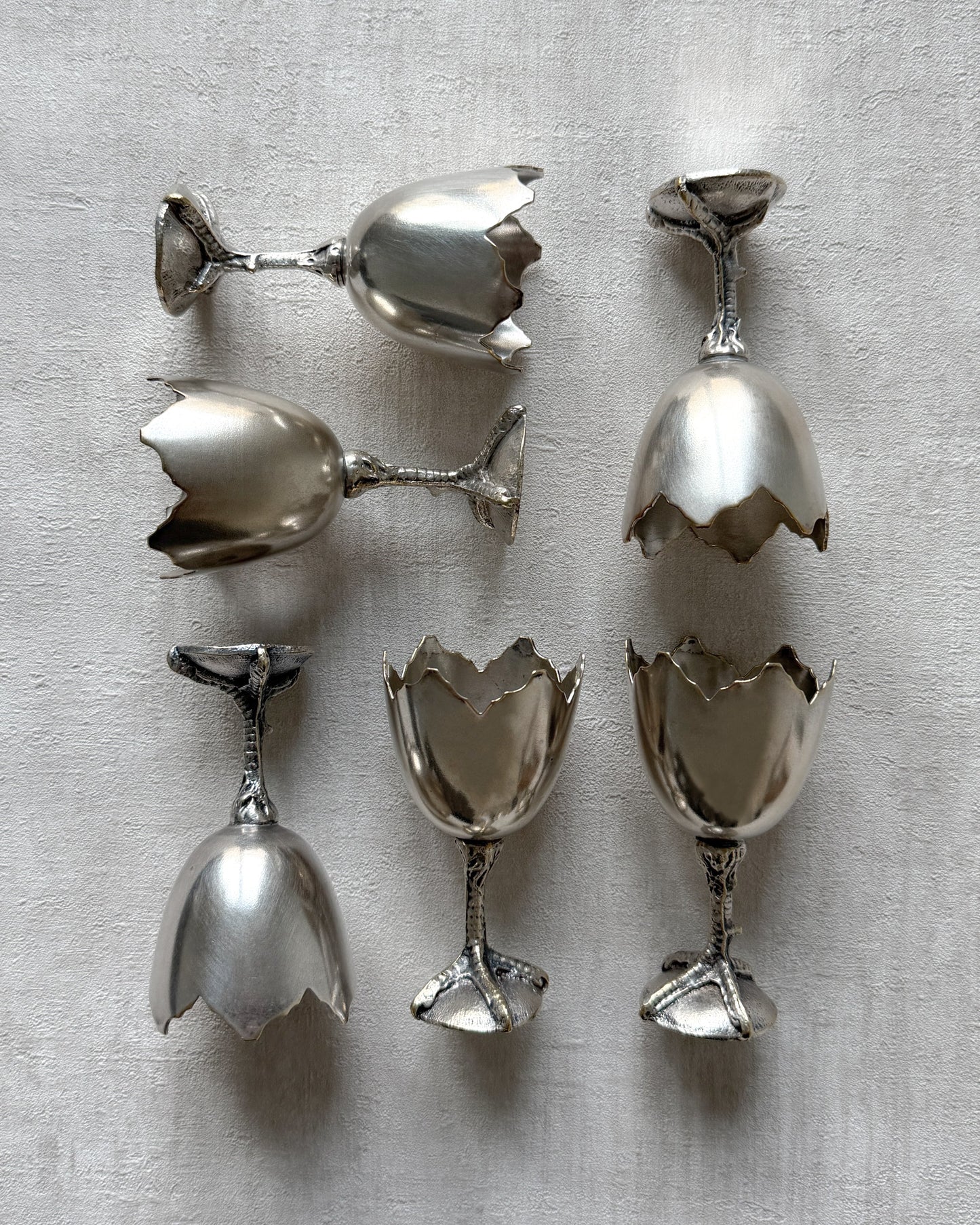 The underside of the vintage egg cup, showing the solid metal construction and any authentic European hallmarks or marks of origin.