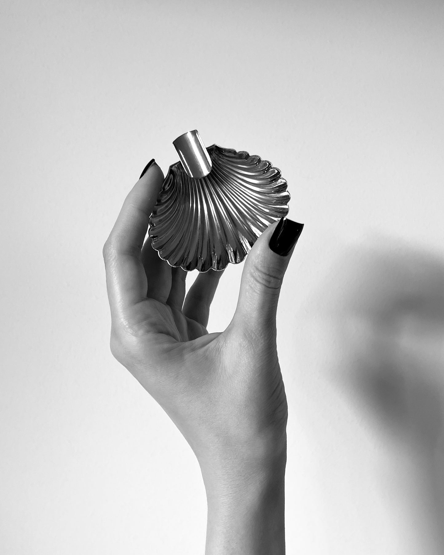 The underside of the Florentine silver ashtray, displaying the two small, rounded "ball" feet that provide stability to the design.
