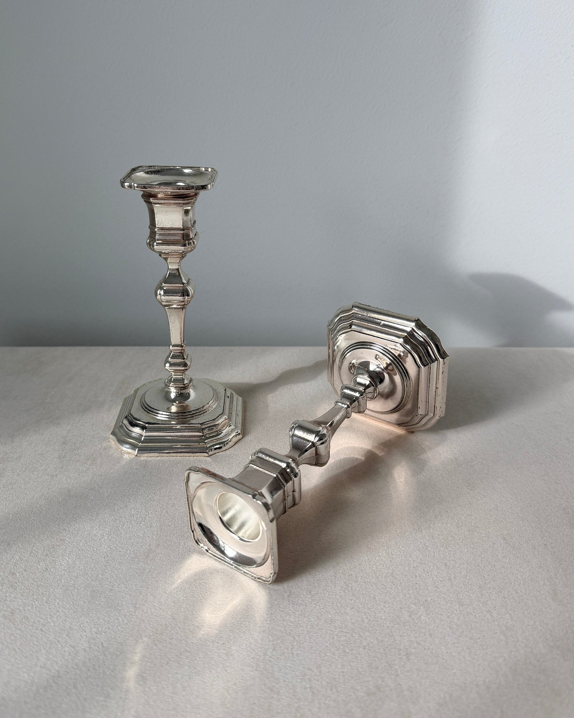 Top-down view of the silver-plated taper holders, showcasing the refined European craftsmanship suitable for a Scandi-style home or minimalist wedding.