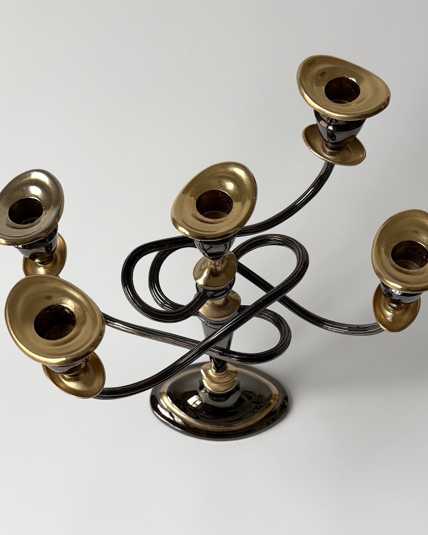 A full side profile of the five-arm twisted candelabra, showcasing the captivating architectural arc that suits both eclectic and modern interiors.