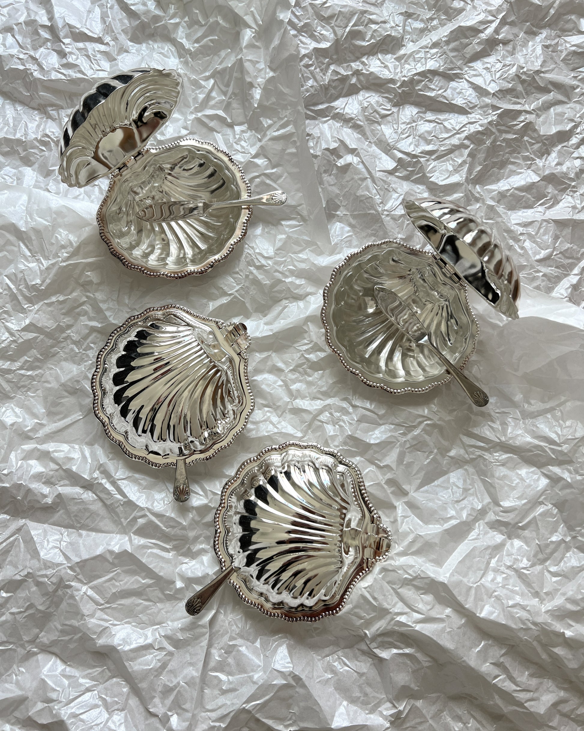 Side profile of the vintage Sheffield silver-plated shell butter and caviar serving dish, illustrating its elegant design and compact dimensions.